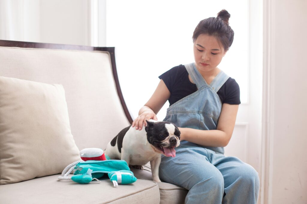 A girls with a dog for a vet check before pet travel
